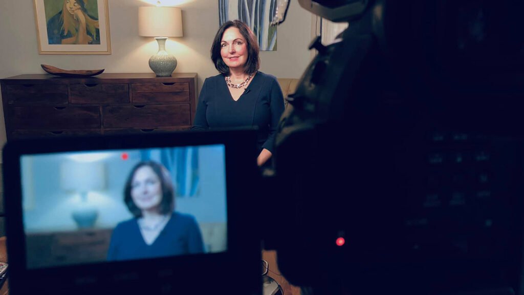 Cyndi Crocker, partner at Slice Legal Marketing and Crocker Law Firm being interviewed by a camera behind the scenes for video marketing for law firms