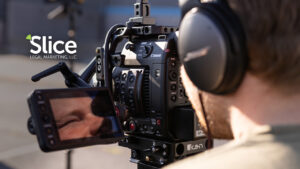 videographer looking at an LCD screen on a camera filming an attorney talking for video marketing